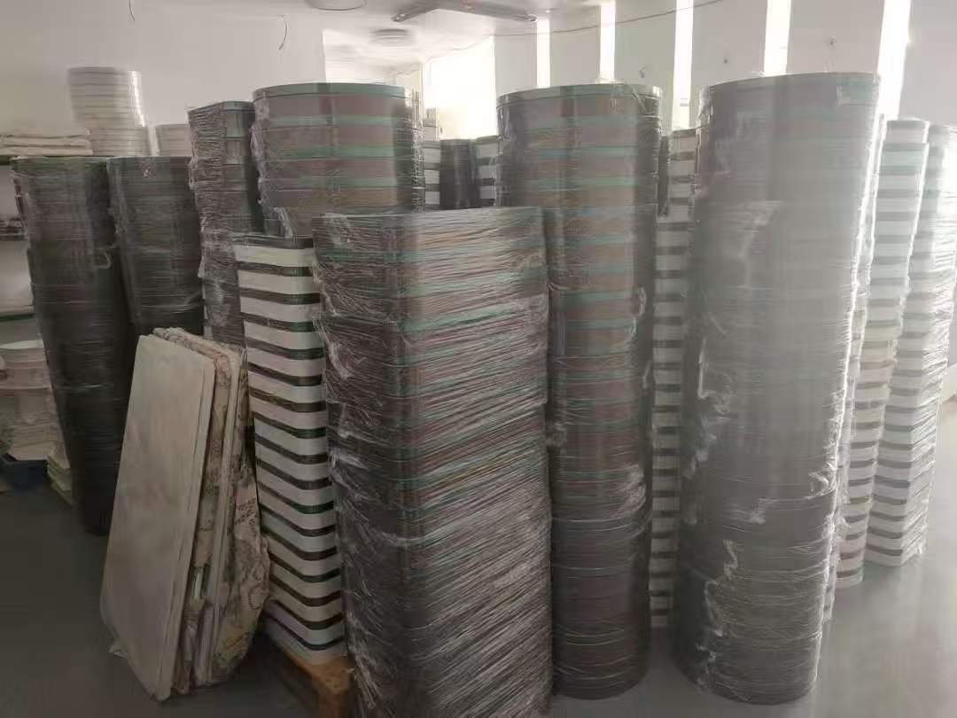 Stacks of aluminium lighting parts during production