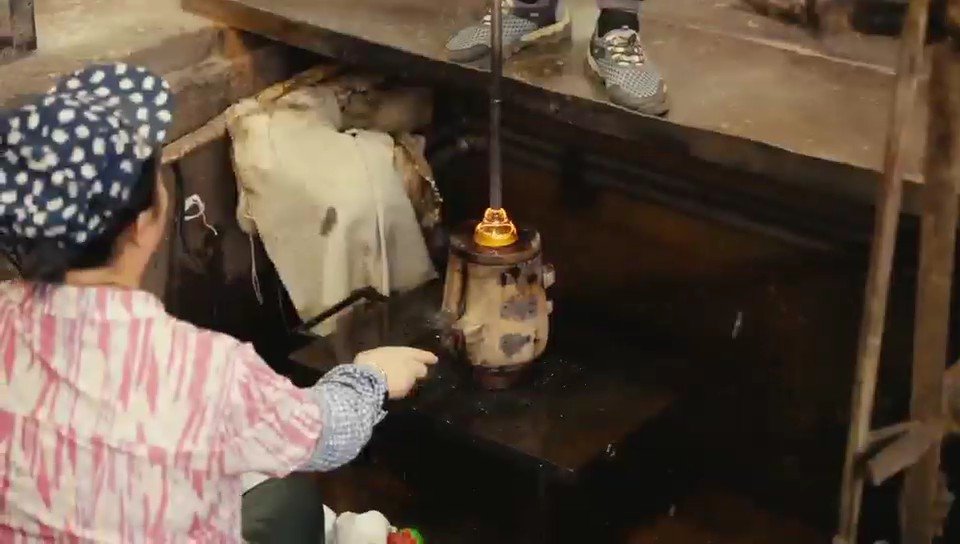 Craftsman shaping heated glass at our partner workshop