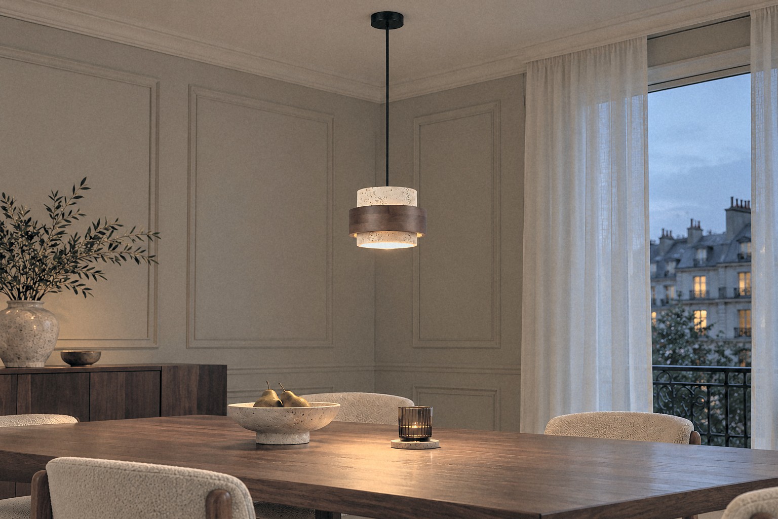 Travertine pendant glowing at dusk in a panelled dining room